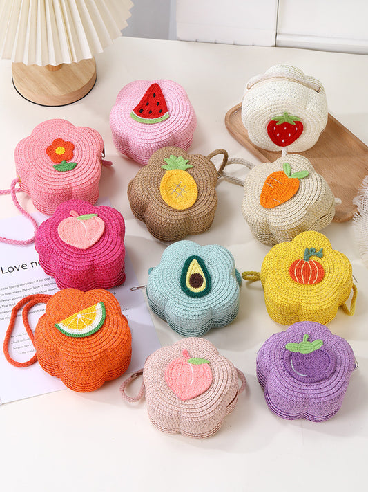 Bolso bandolera infantil con estampados de frutas y flores.