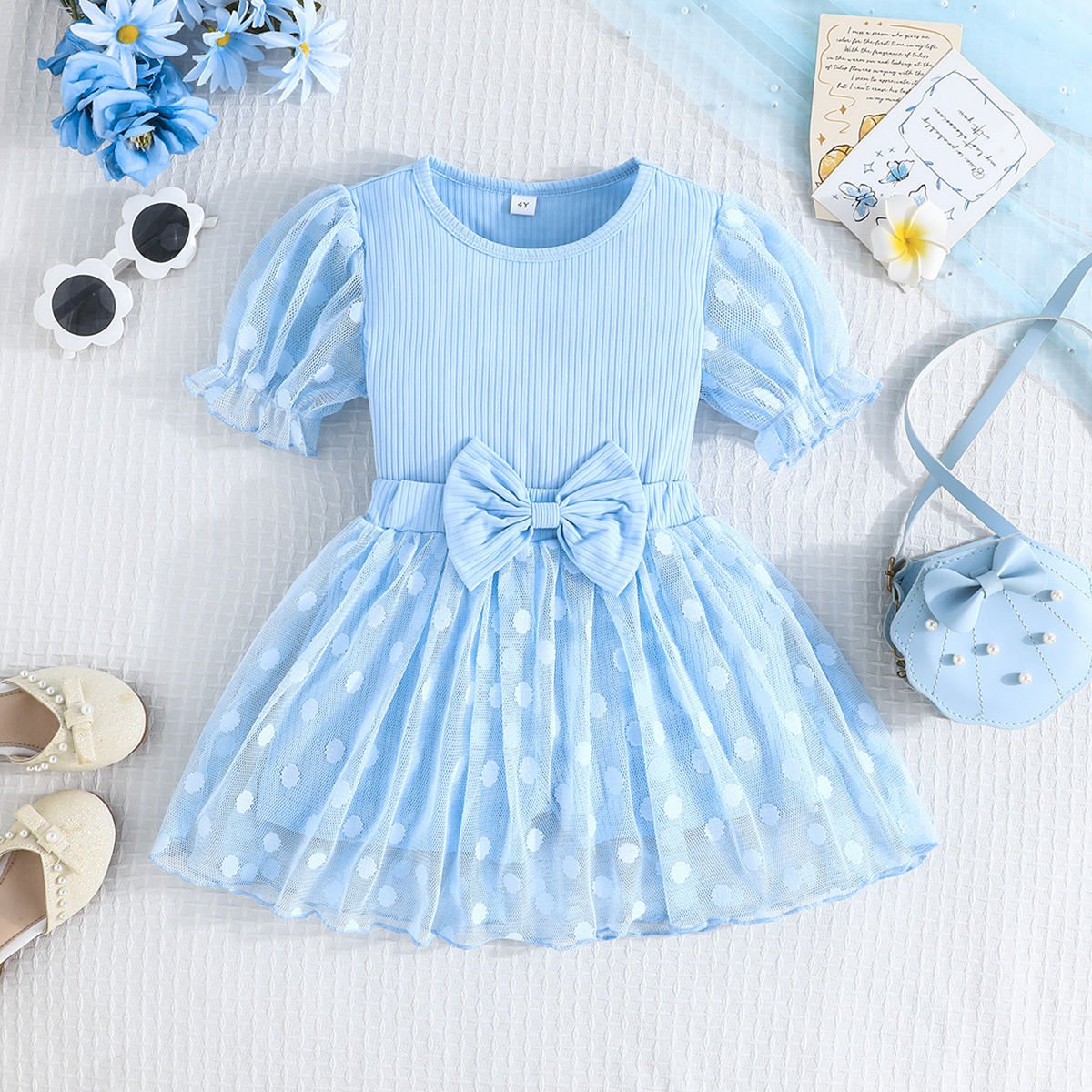 فستان بناتي مزين بفيونكة وتول منقط بتصميم  صيفي